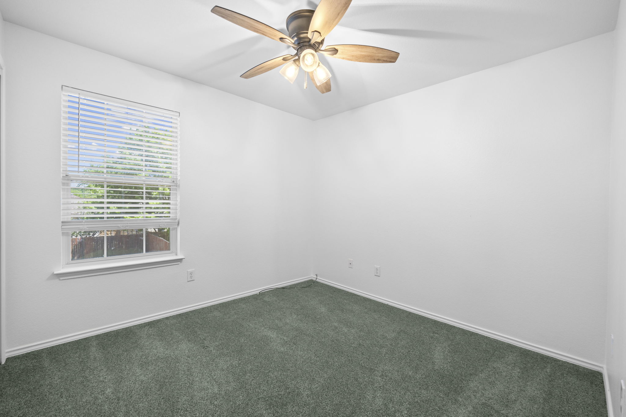 89 Jan Lane Georgetown, TX 78626 - Photo 23 of 29 Unfurnished room with a ceiling fan and dark carpet