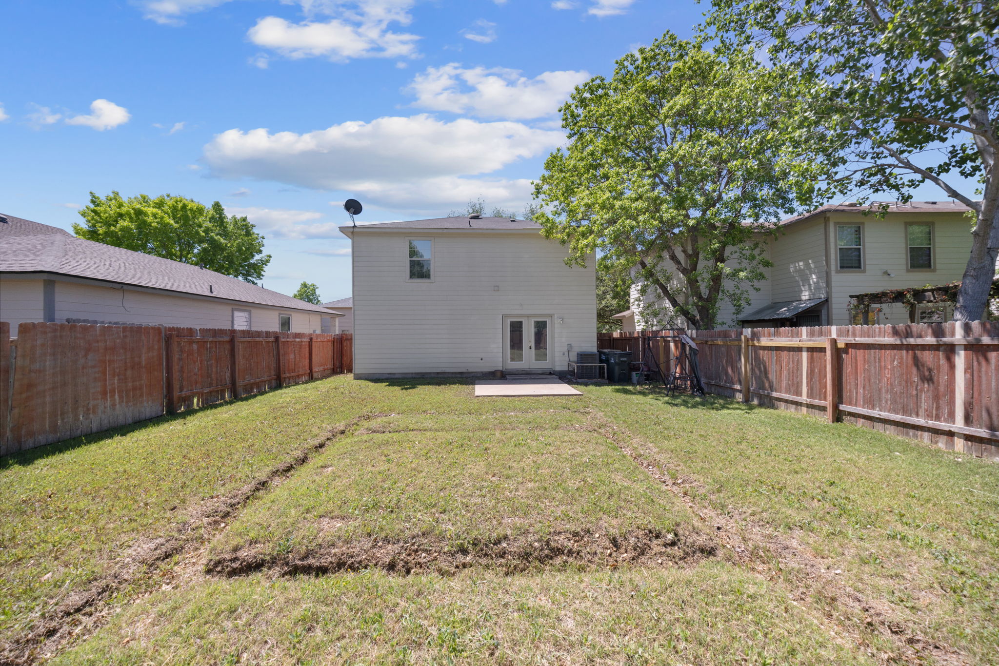 89 Jan Lane Georgetown, TX 78626 - Photo 28 of 29 Back of house featuring a patio area, french doors, and a fenced backyard