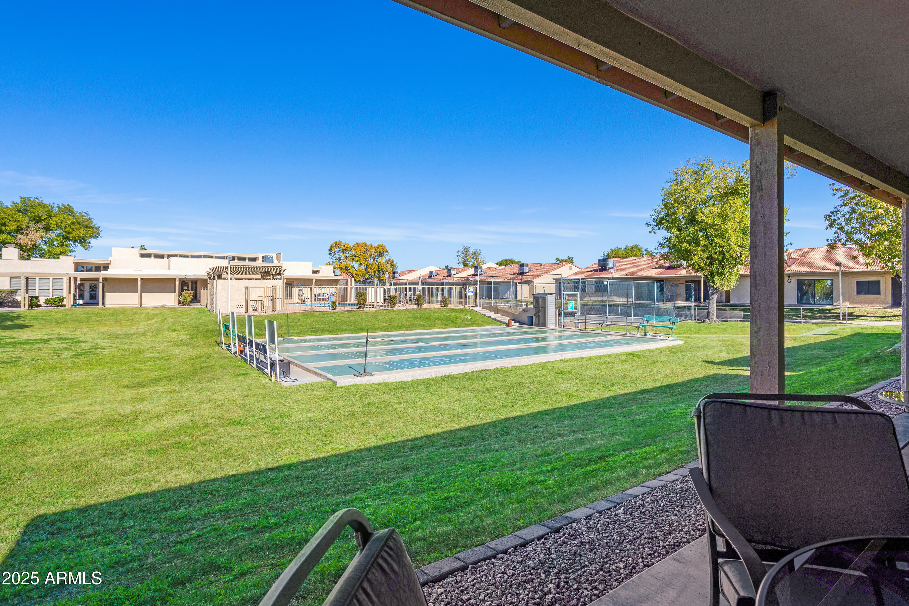 a view of a big yard with a swimming pool
