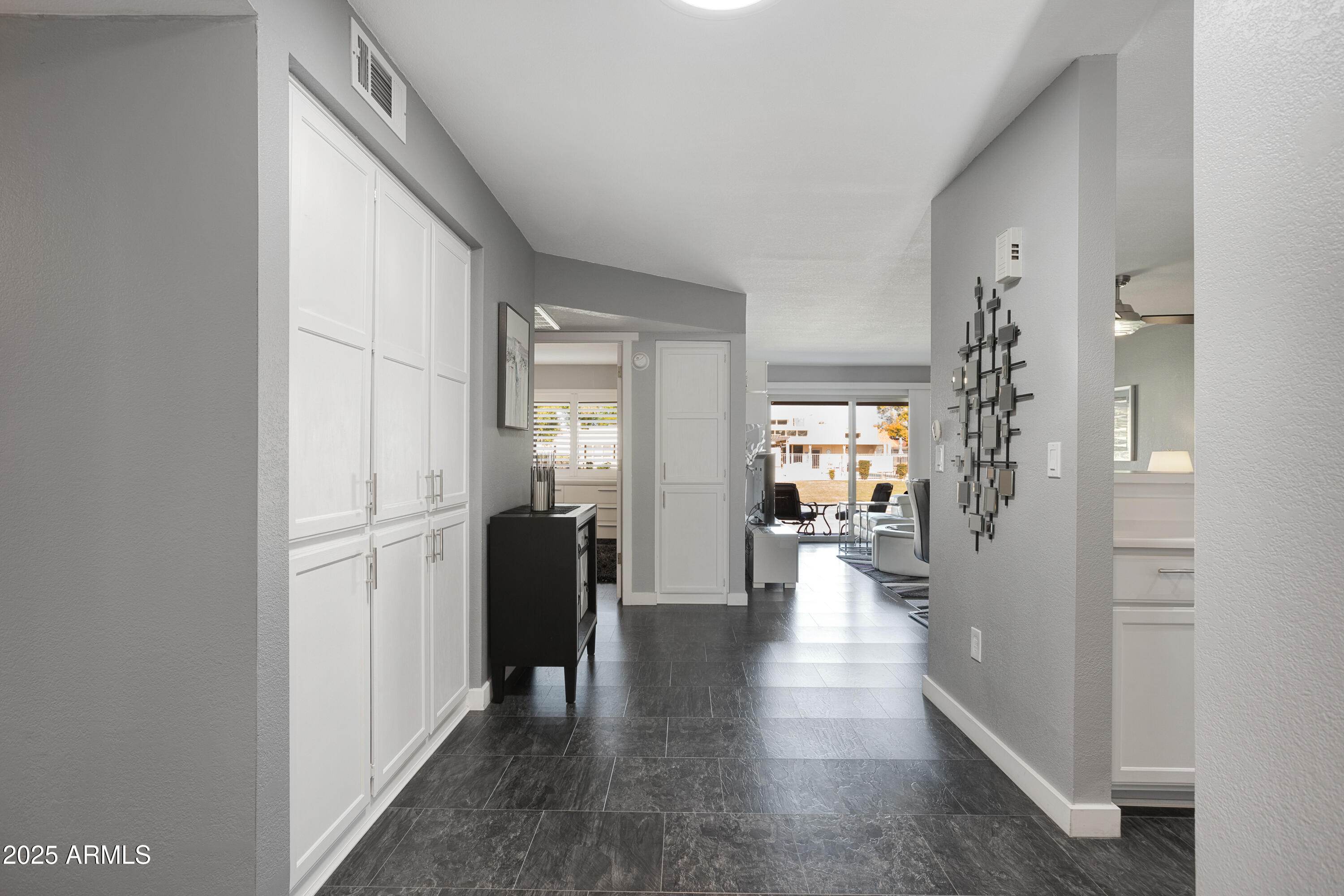 1021 South Greenfield Road, Unit 1195 Mesa, AZ 85206 - Photo 11 of 41 a view of a hallway with wooden floor windows and livingroom