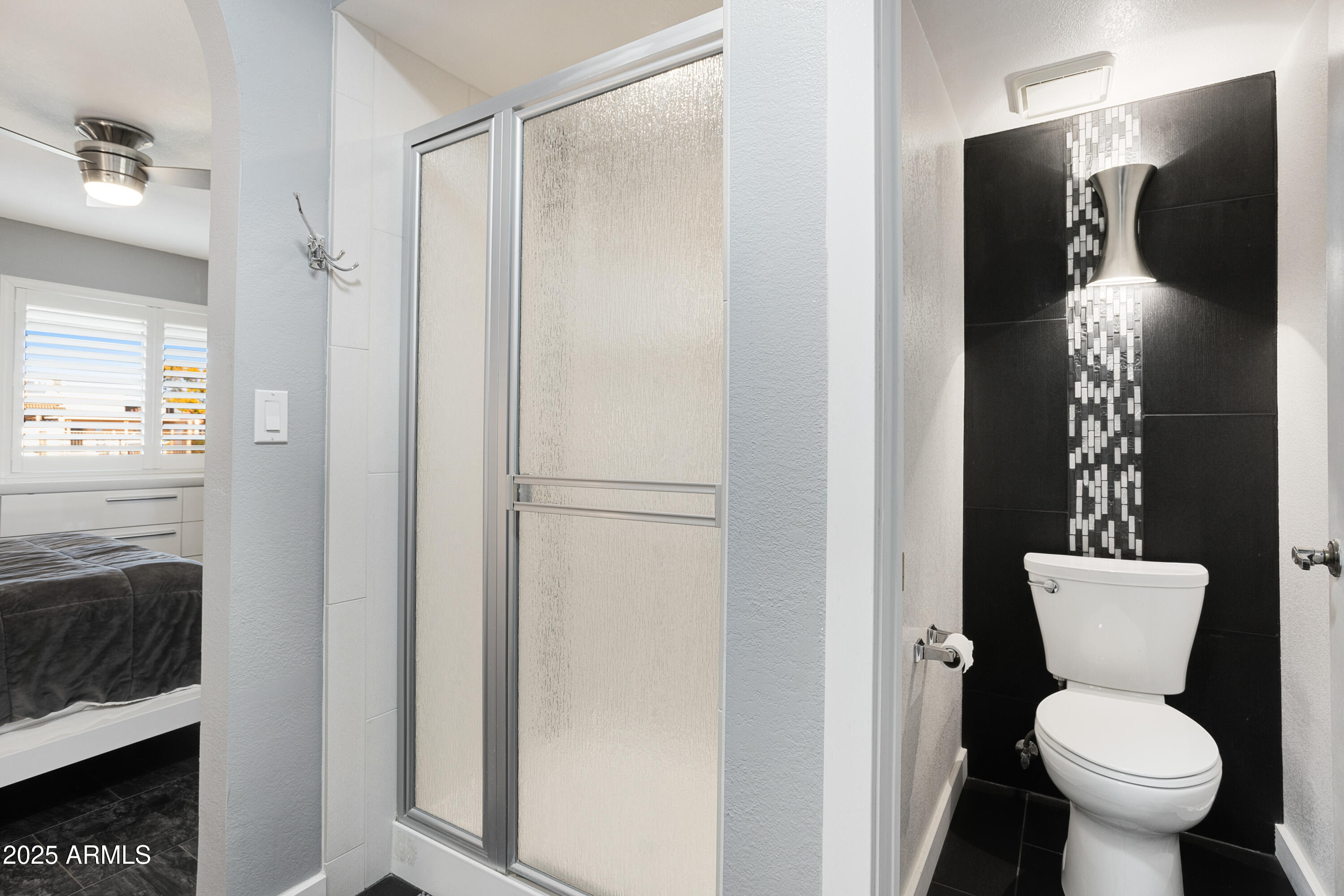 1021 South Greenfield Road, Unit 1195 Mesa, AZ 85206 - Photo 19 of 41 a bathroom with a toilet and a shower