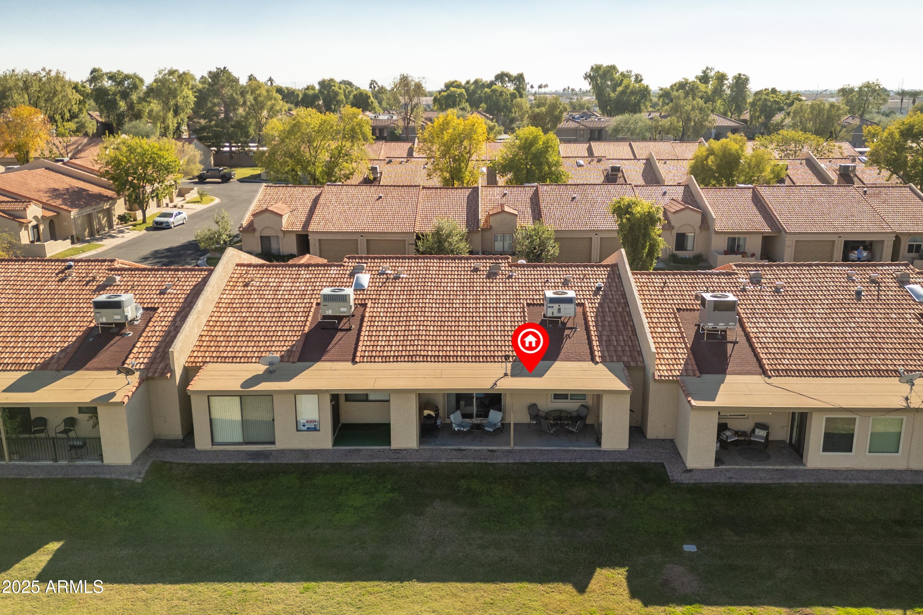 1021 South Greenfield Road, Unit 1195 Mesa, AZ 85206 - Photo 27 of 41 a view of multiple houses with a yard