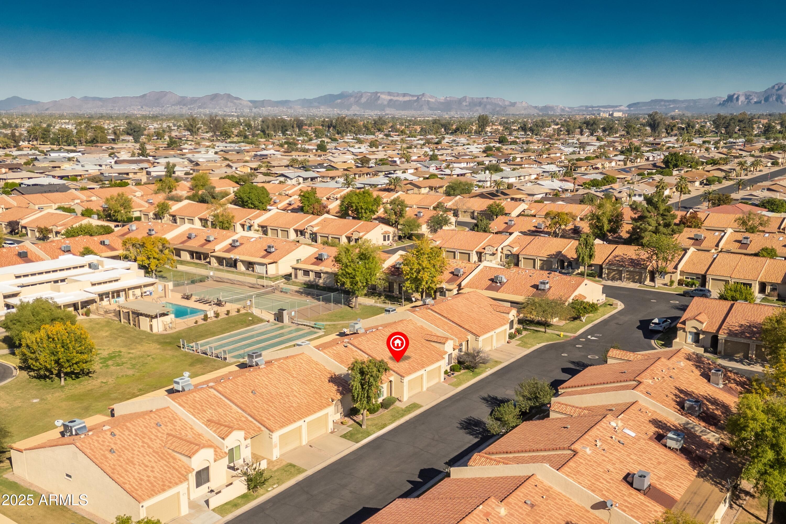 1021 South Greenfield Road, Unit 1195 Mesa, AZ 85206 - Photo 28 of 41 an aerial view of residential houses with outdoor space