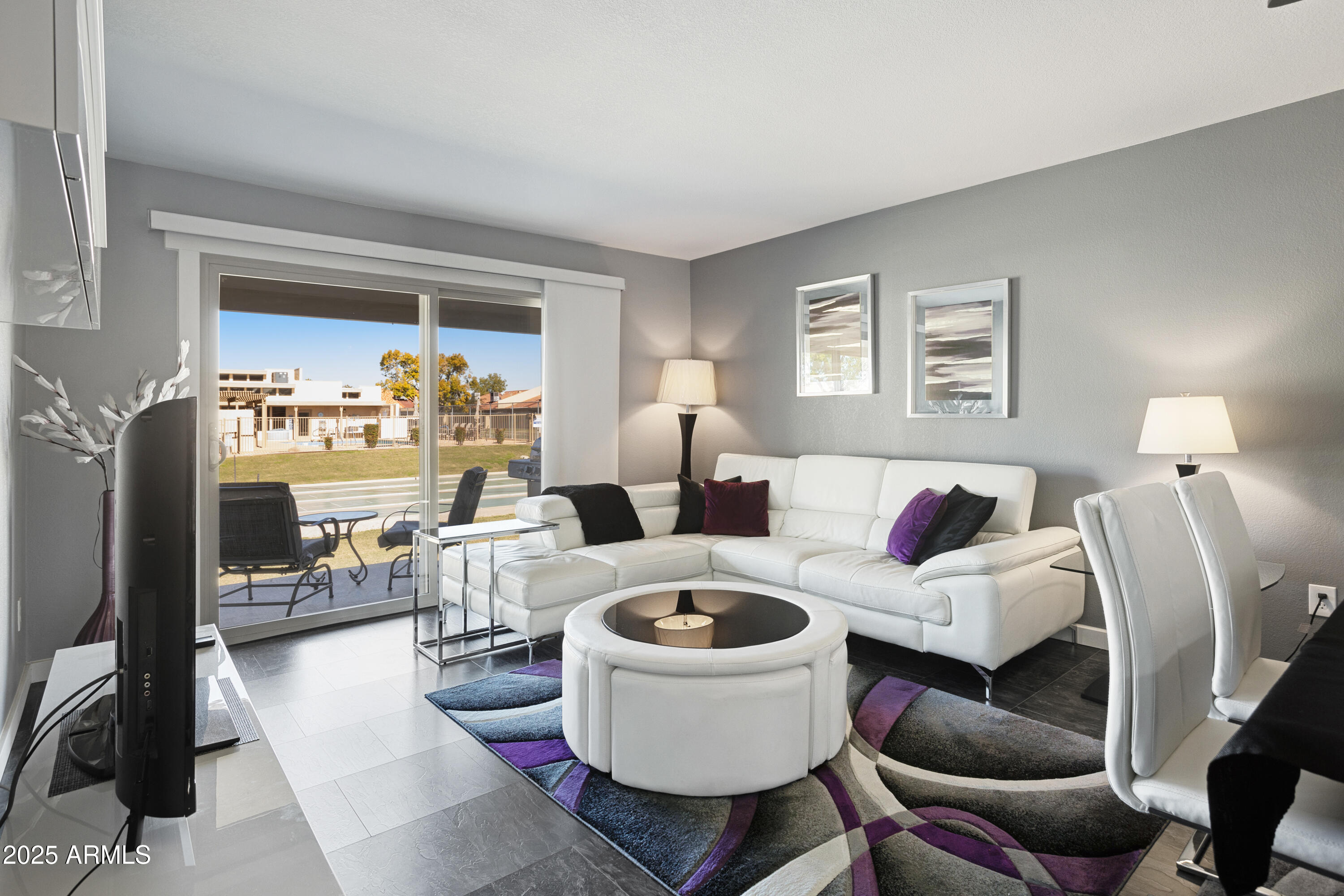 1021 South Greenfield Road, Unit 1195 Mesa, AZ 85206 - Photo 2 of 41 a living room with furniture and a fireplace