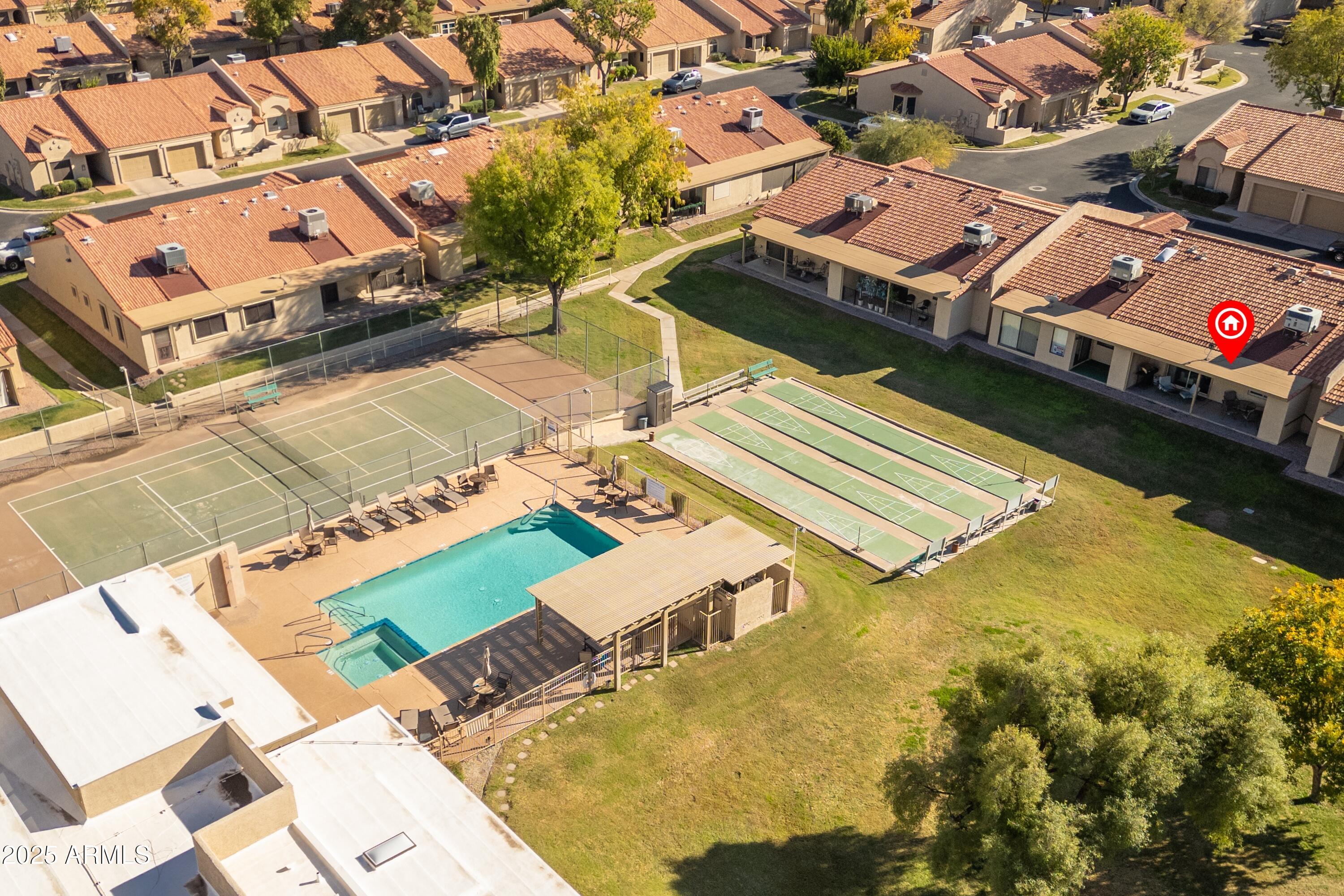 1021 South Greenfield Road, Unit 1195 Mesa, AZ 85206 - Photo 32 of 41 an aerial view of a house with a swimming pool