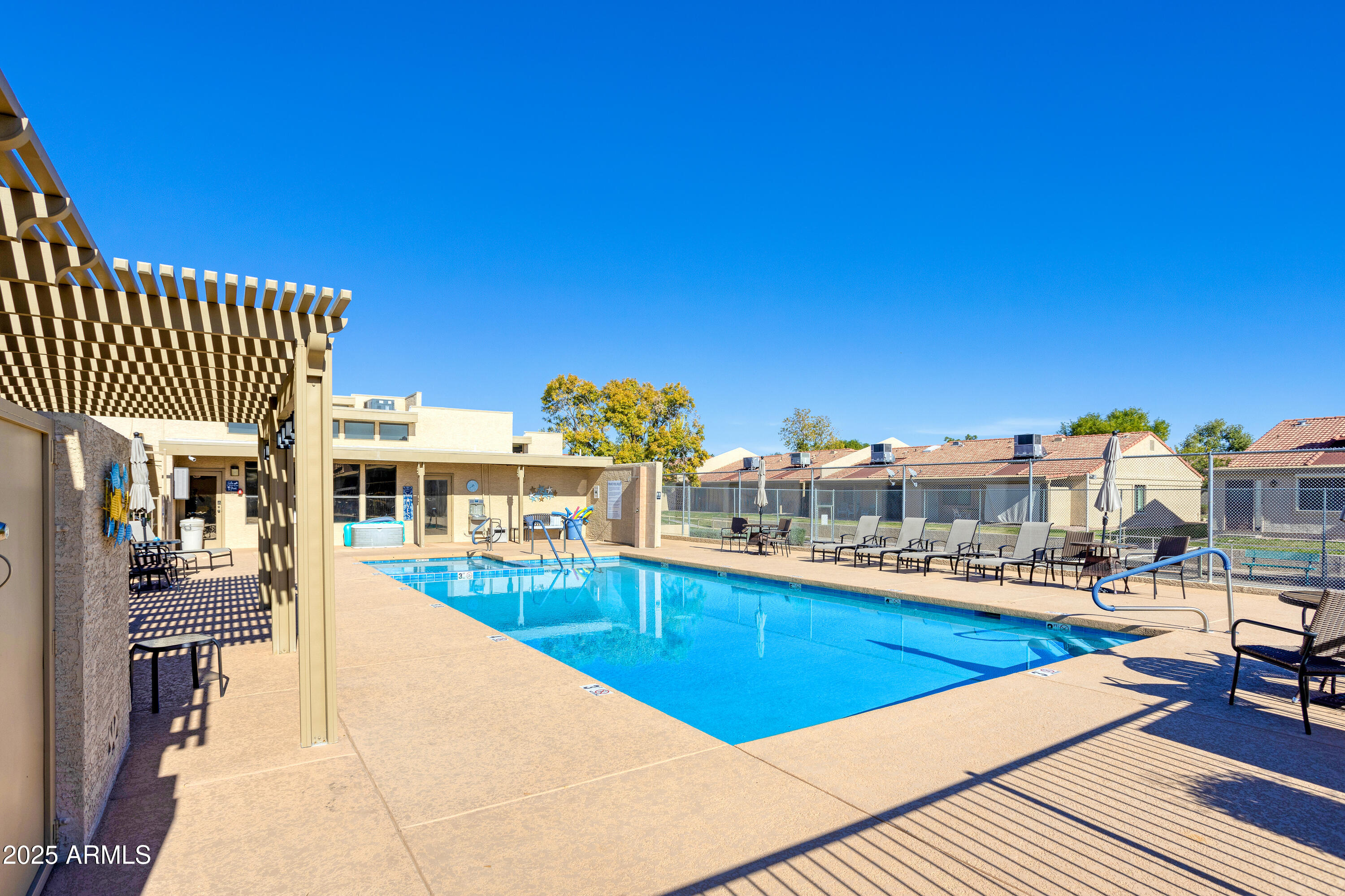 1021 South Greenfield Road, Unit 1195 Mesa, AZ 85206 - Photo 33 of 41 a view of a swimming pool with outdoor seating