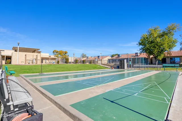a view of a swimming pool with outdoor seating