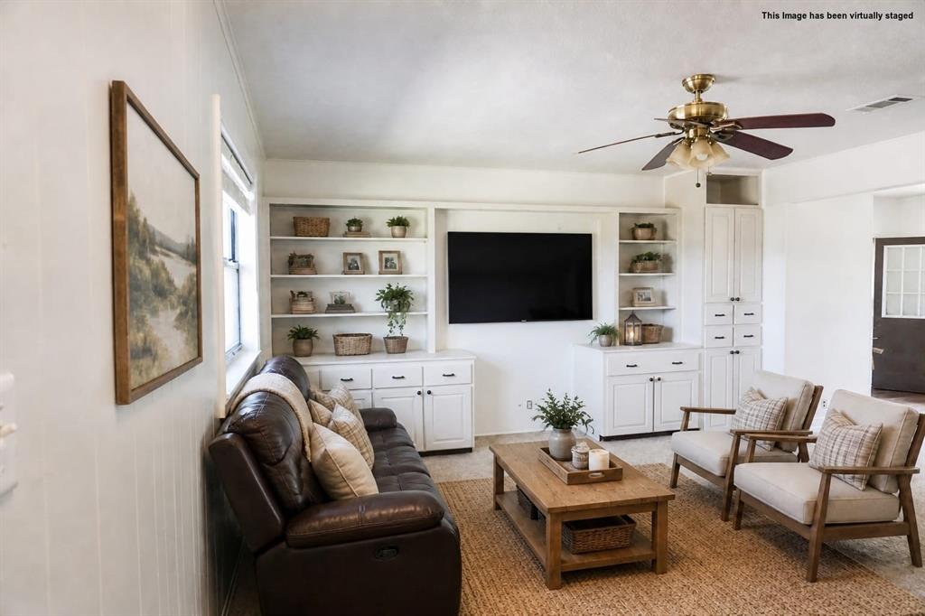 Built-in cabinetry with open shelving and closed storage