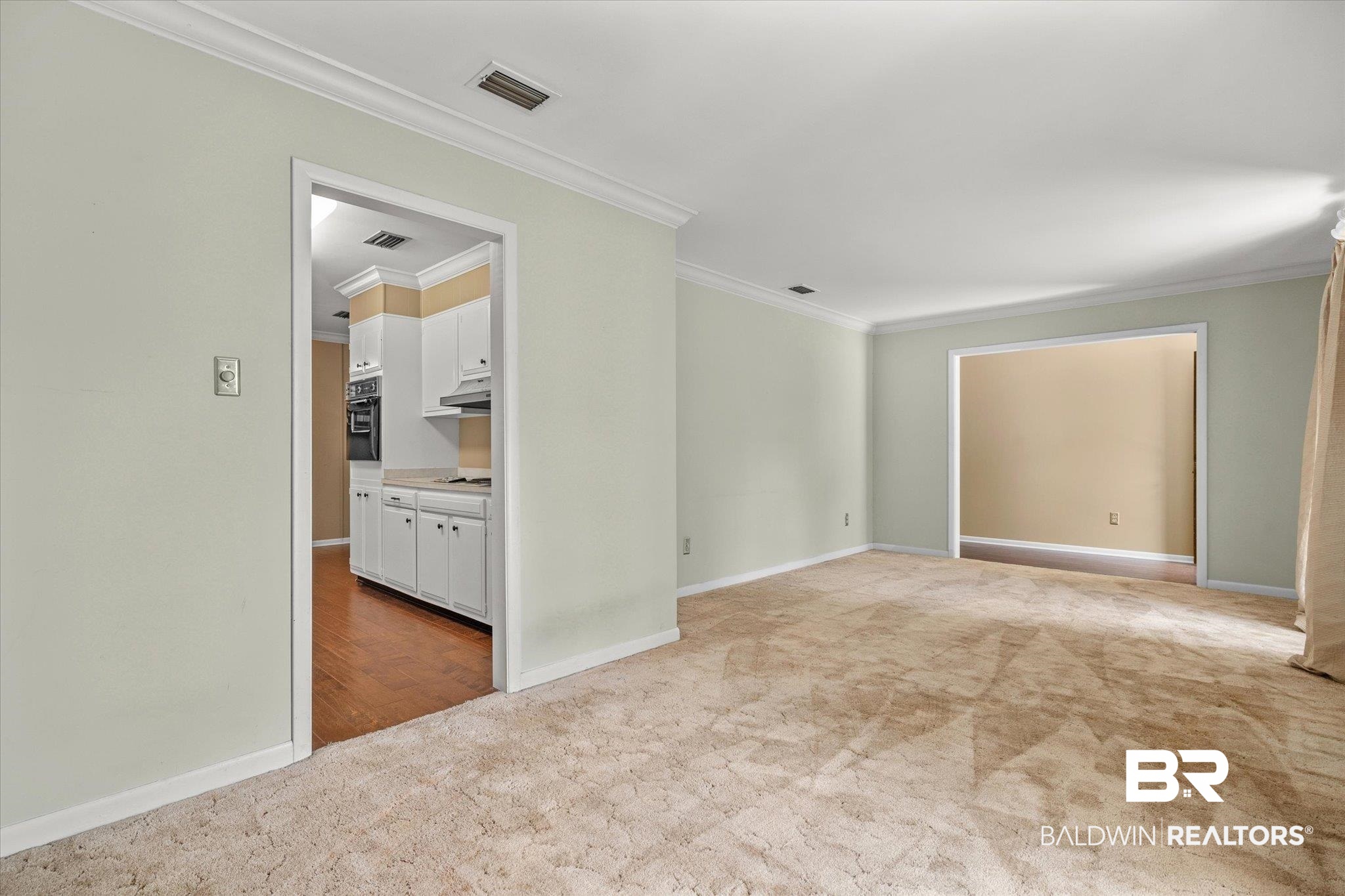 5608 Judson Circle Mobile, AL 36608 - Photo 3 of 20 Empty room with light carpet and ornamental molding
