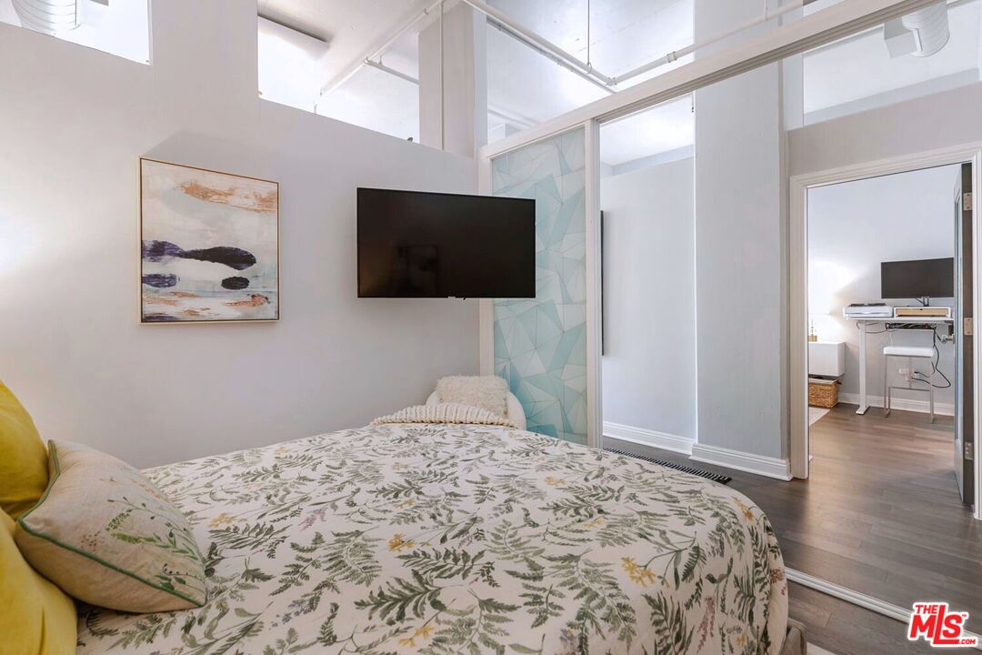645 West 9th Street, Unit 740 Los Angeles, CA 90015 - Photo 29 of 63 a bedroom with a bed and a flat screen tv