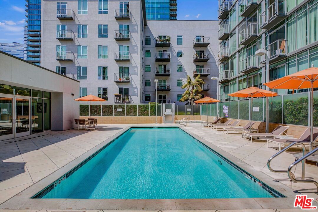 645 West 9th Street, Unit 740 Los Angeles, CA 90015 - Photo 33 of 63 a view of pool with outdoor seating