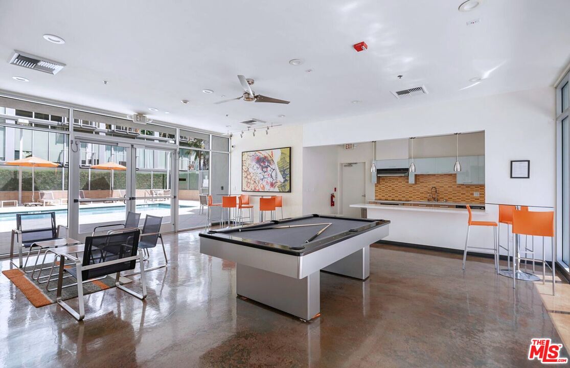 645 West 9th Street, Unit 740 Los Angeles, CA 90015 - Photo 37 of 63 a kitchen with stainless steel appliances granite countertop a stove and a refrigerator