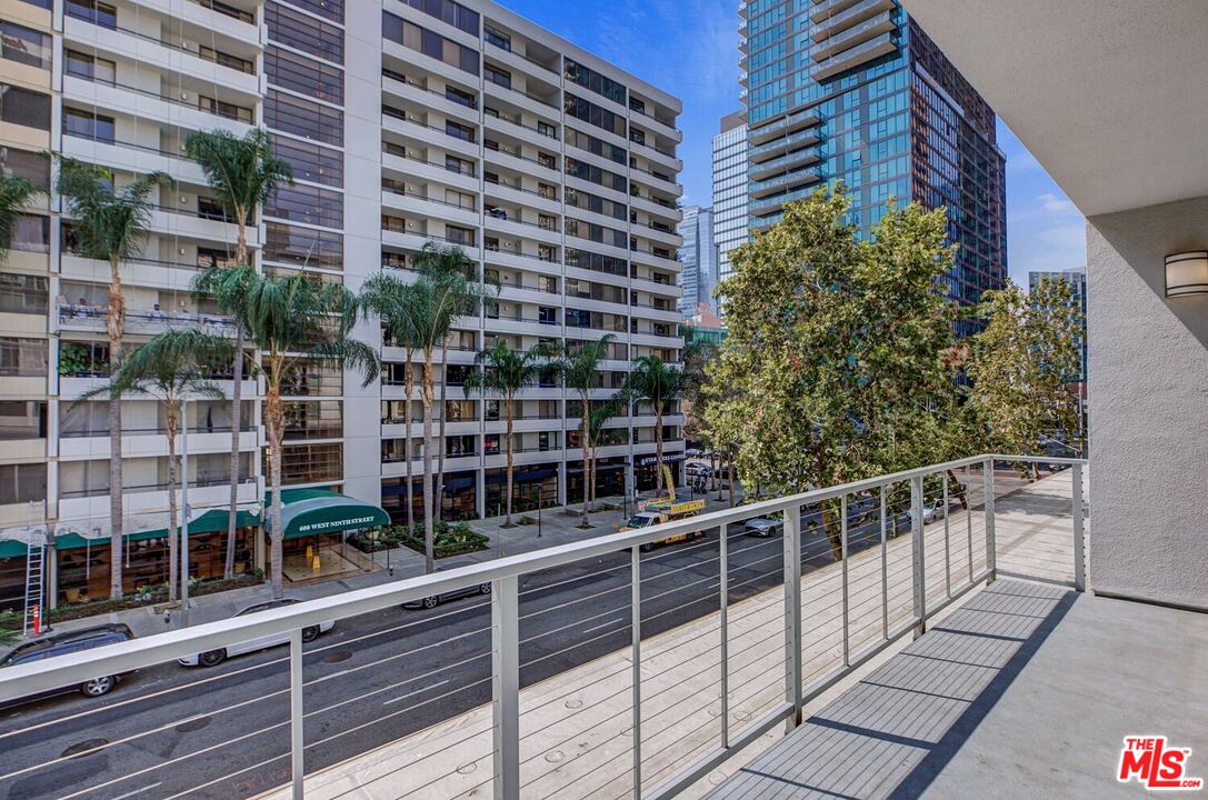 645 West 9th Street, Unit 740 Los Angeles, CA 90015 - Photo 39 of 63 a view of a balcony with wooden floor and windows