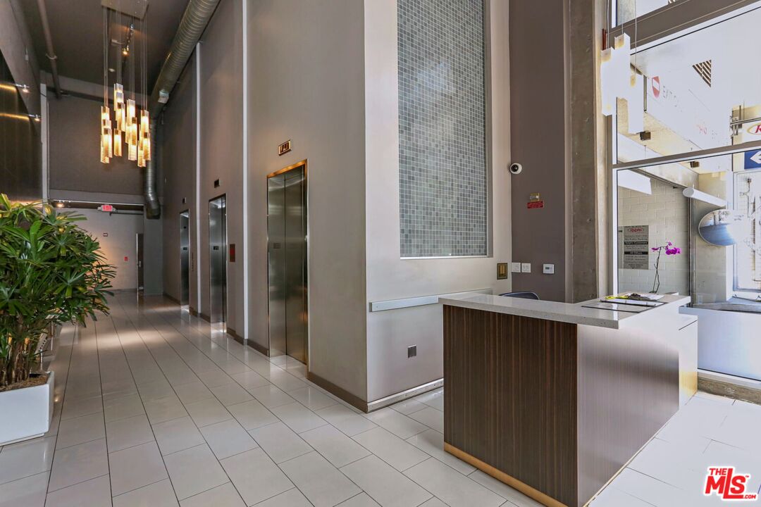 645 West 9th Street, Unit 740 Los Angeles, CA 90015 - Photo 4 of 63 a view of living room filled with furniture and window