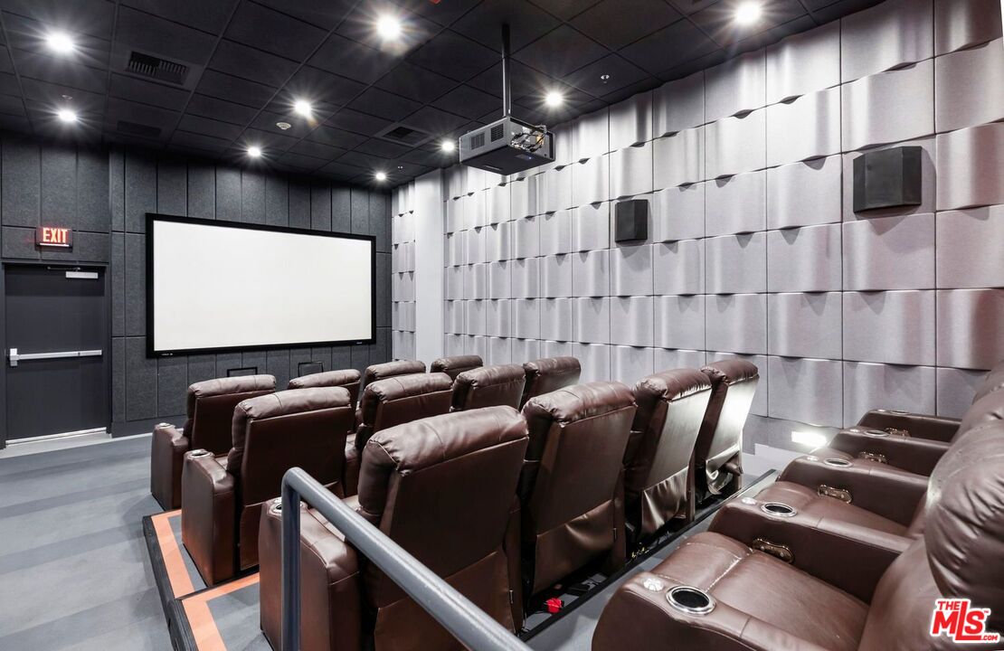 645 West 9th Street, Unit 740 Los Angeles, CA 90015 - Photo 44 of 63 a media room with lots of chairs and a projector