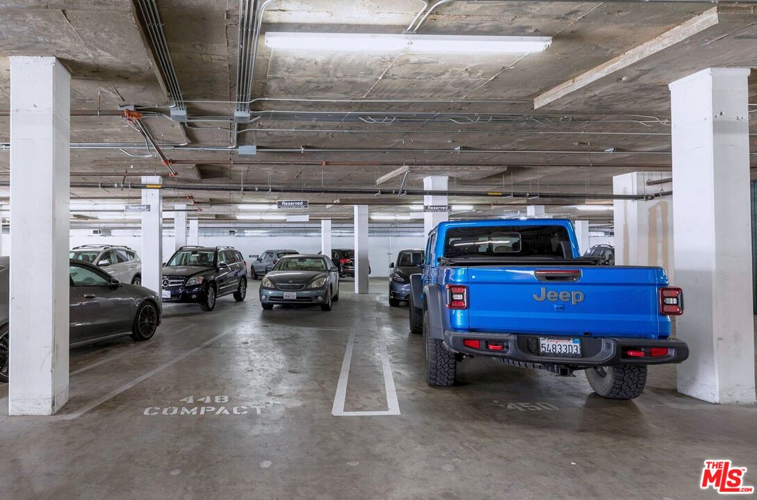 645 West 9th Street, Unit 740 Los Angeles, CA 90015 - Photo 46 of 63 a view of parking garage with cars parked