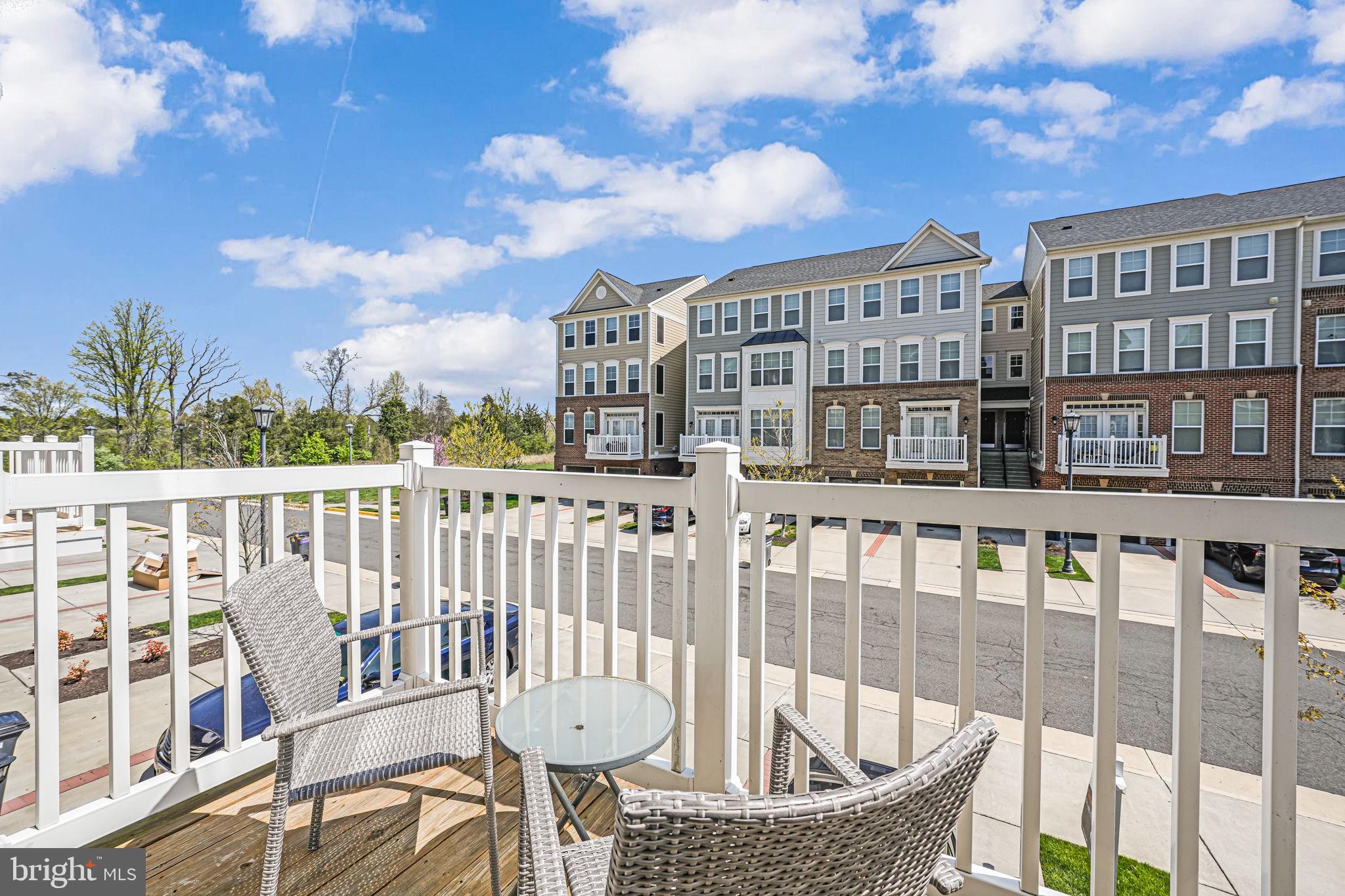 43373 Town Gate Square Chantilly, VA 20152 - Photo 16 of 30 a view of a balcony with two chairs and a table