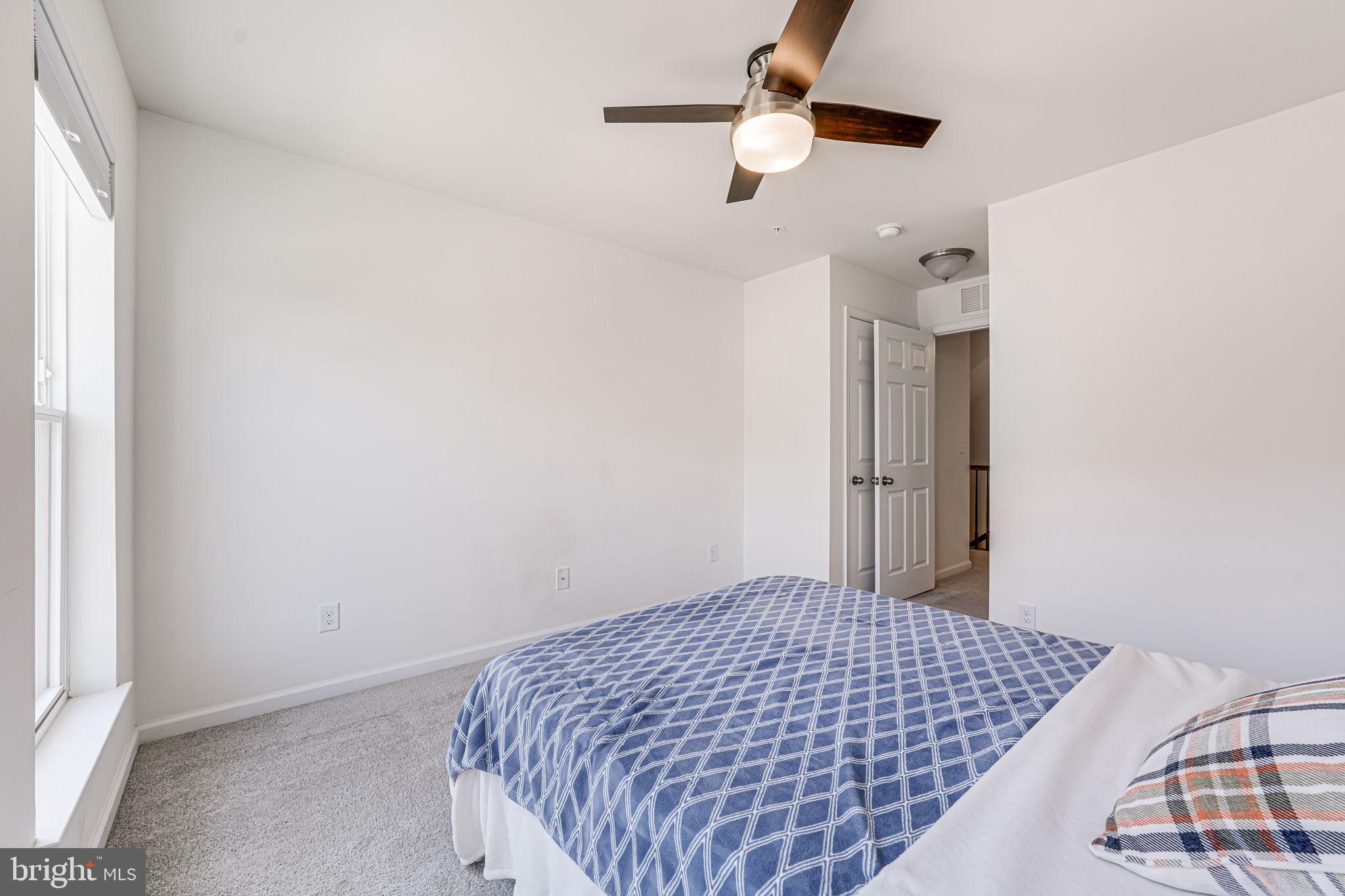 43373 Town Gate Square Chantilly, VA 20152 - Photo 20 of 30 a bedroom with a bed and a window