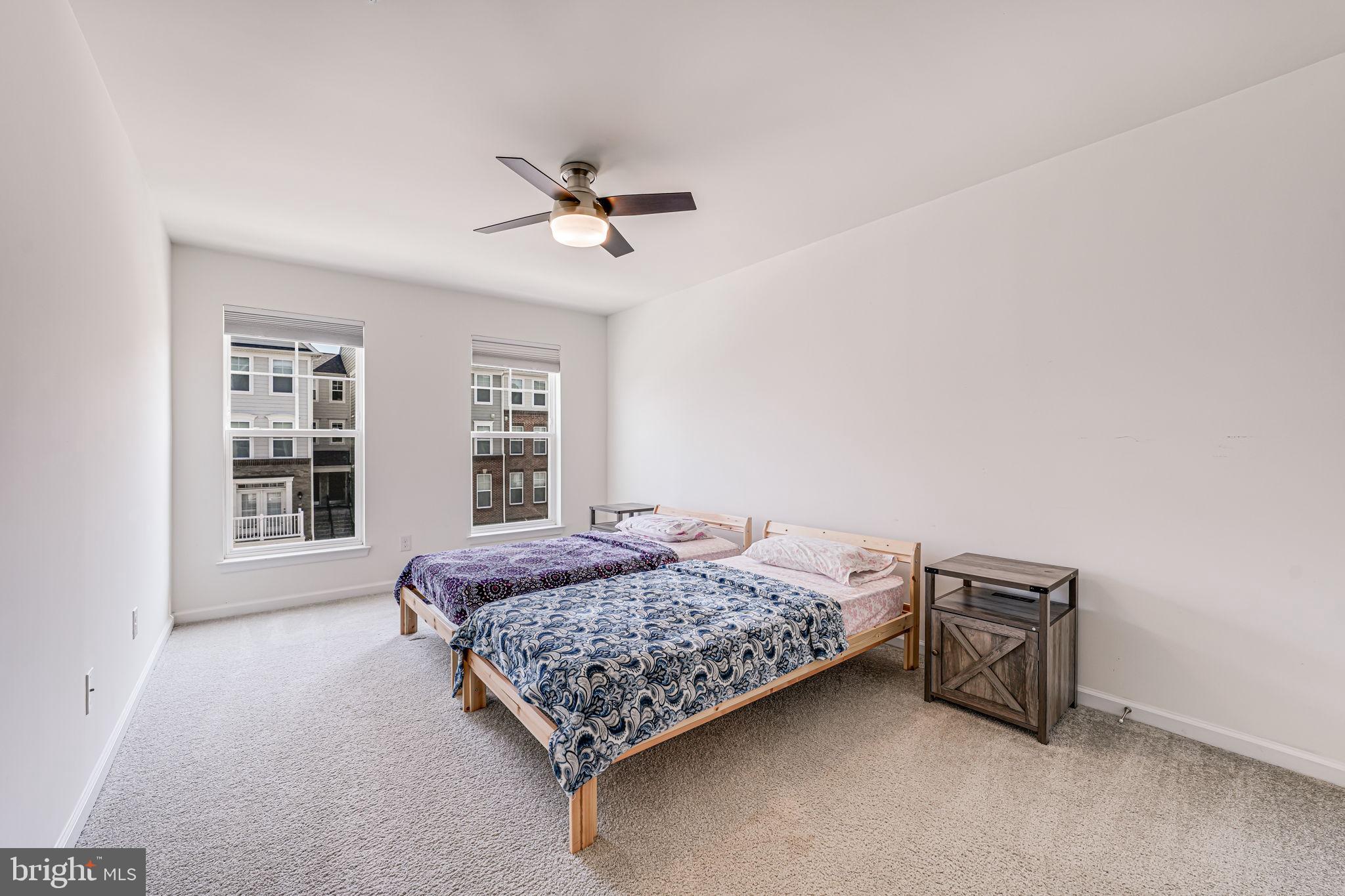 43373 Town Gate Square Chantilly, VA 20152 - Photo 21 of 30 a bedroom with a bed and a window