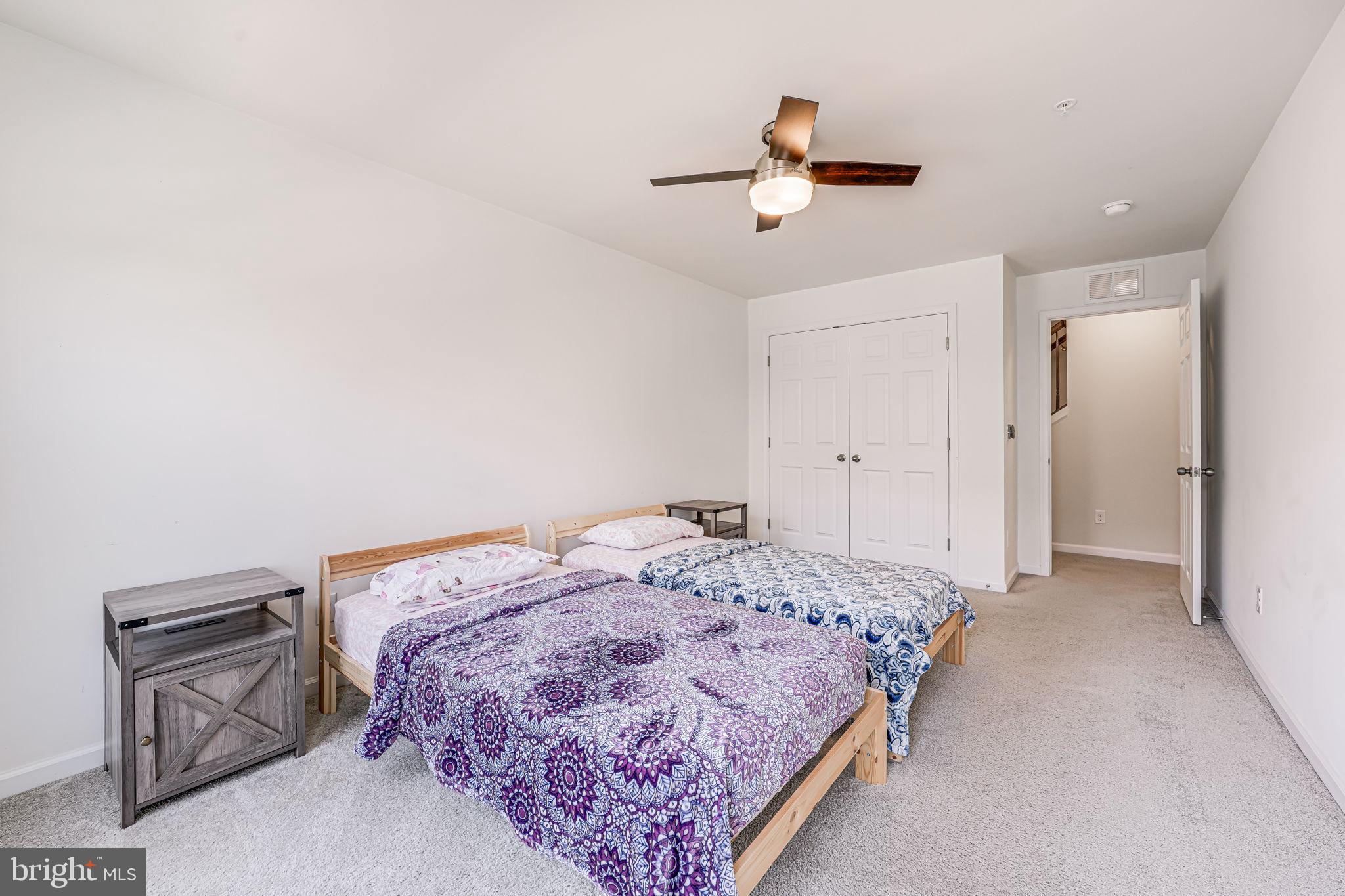 43373 Town Gate Square Chantilly, VA 20152 - Photo 22 of 30 a bedroom with a bed and a chandelier