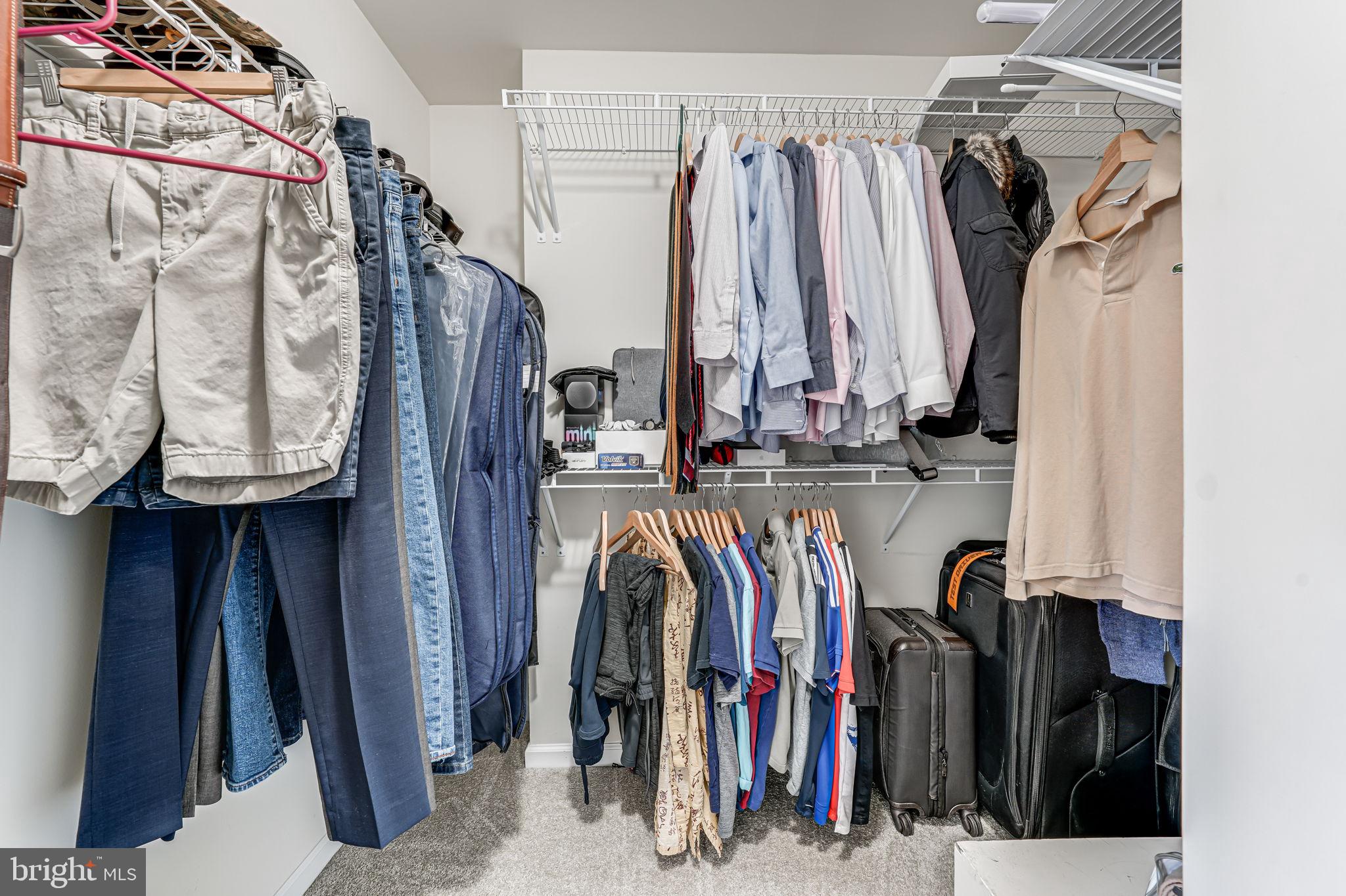 43373 Town Gate Square Chantilly, VA 20152 - Photo 27 of 30 a view of walk in closet with clothes