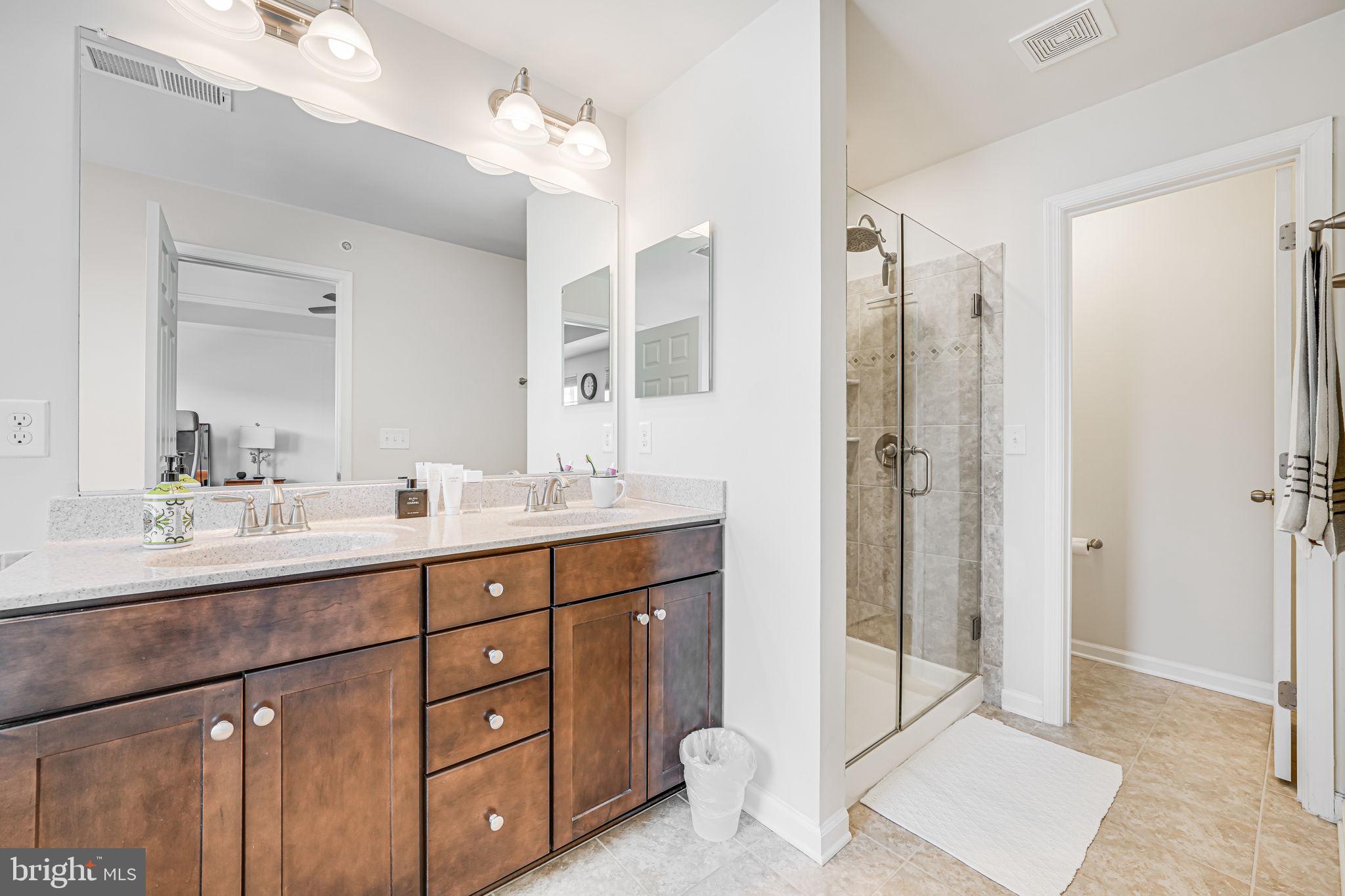 43373 Town Gate Square Chantilly, VA 20152 - Photo 28 of 30 a bathroom with a double vanity sink mirror and double
