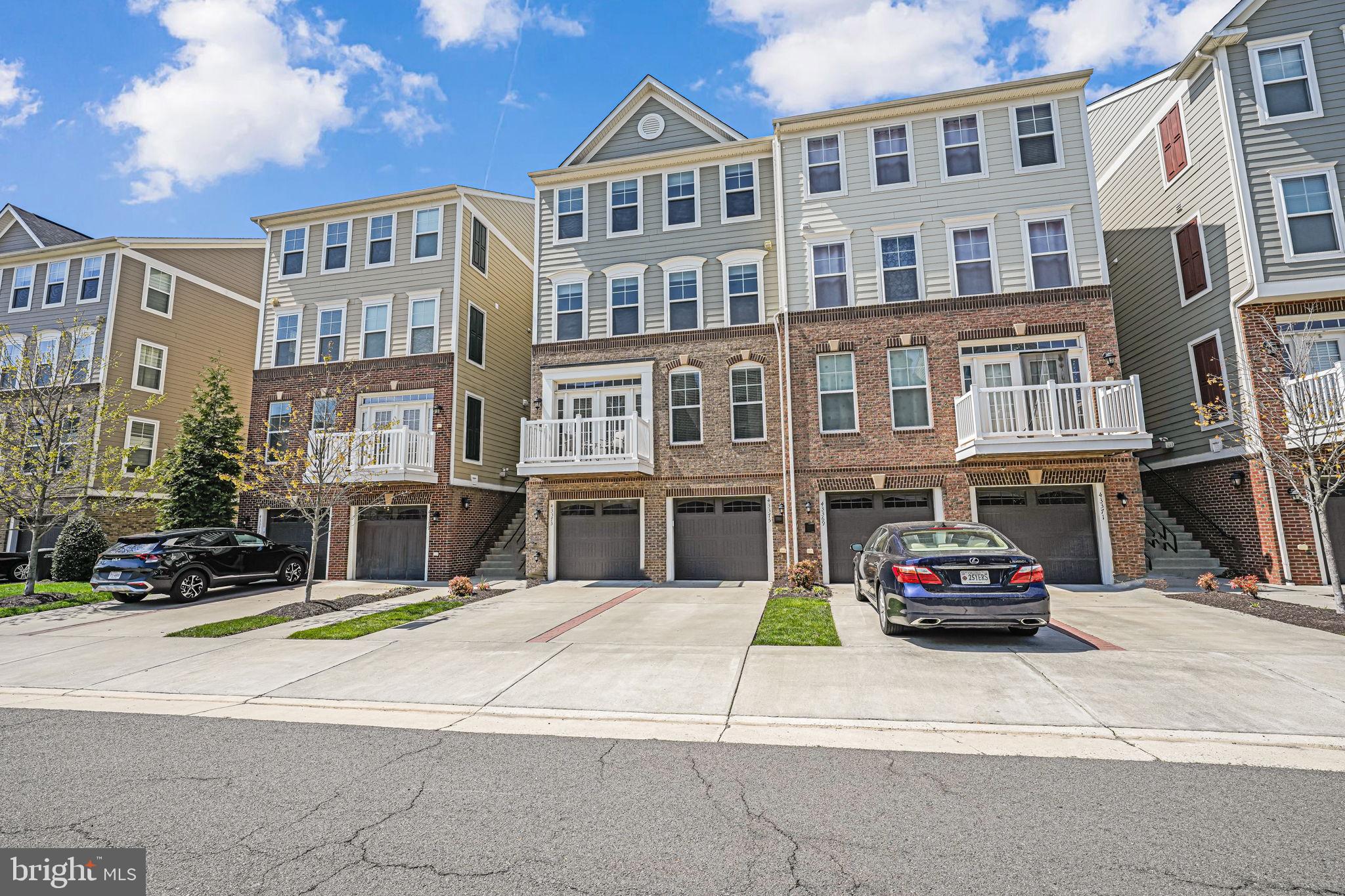 43373 Town Gate Square Chantilly, VA 20152 - Photo 3 of 30 a car parked in front of a brick building