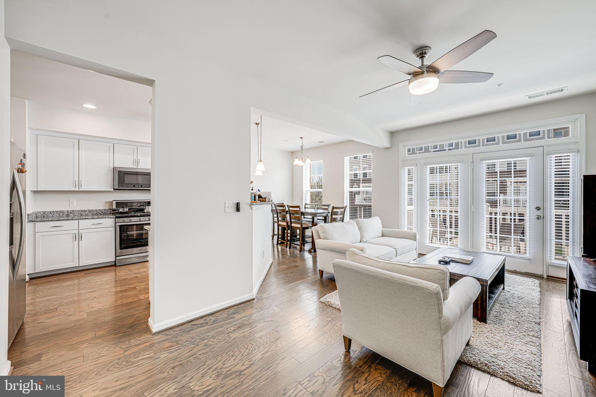43373 Town Gate Square Chantilly, VA 20152 - Photo 4 of 30 a large white kitchen with a large window appliances and cabinets