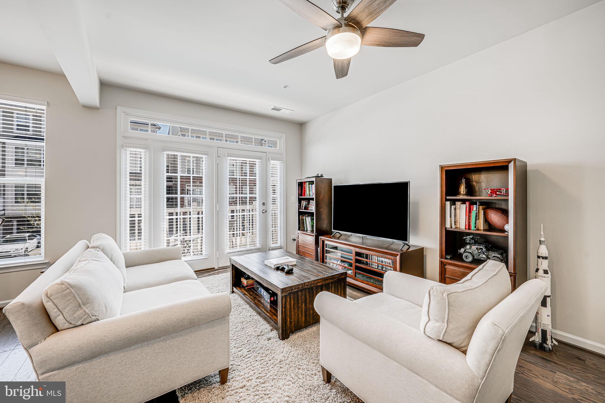 43373 Town Gate Square Chantilly, VA 20152 - Photo 6 of 30 a living room with furniture and a flat screen tv