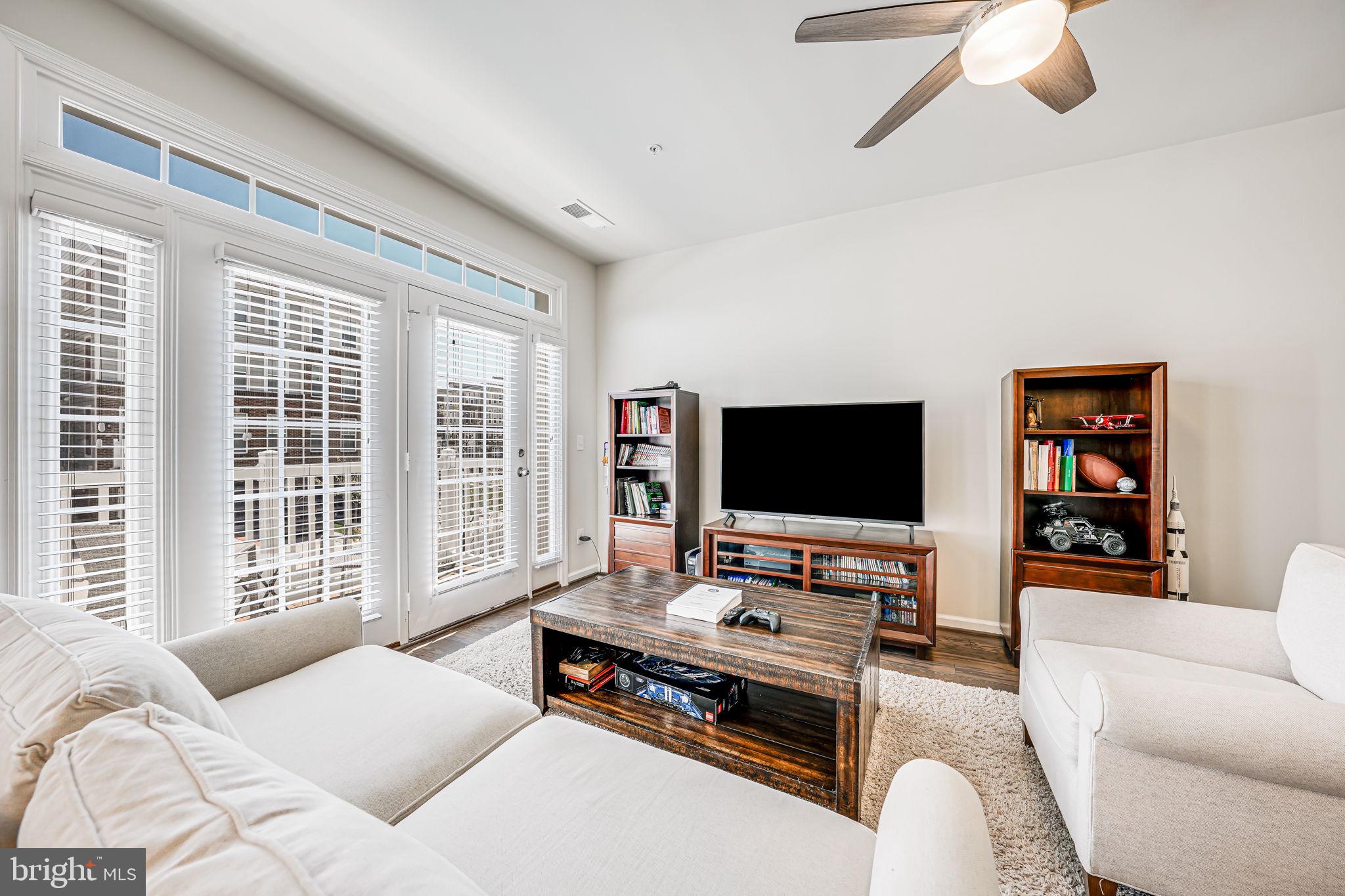 43373 Town Gate Square Chantilly, VA 20152 - Photo 7 of 30 a living room with furniture and a flat screen tv