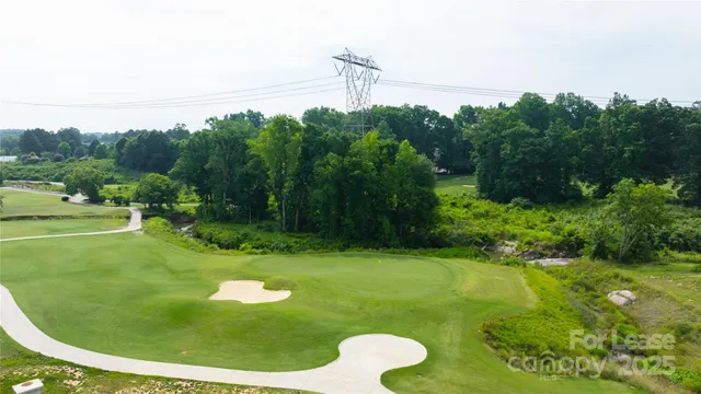 a view of a golf course with a swimming pool