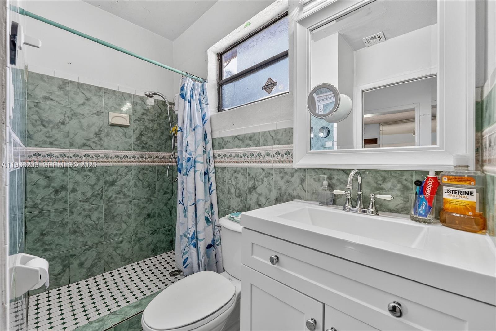 26672 Southwest 137th Court Homestead, FL 33032 - Photo 14 of 34 a bathroom with a sink a toilet and shower