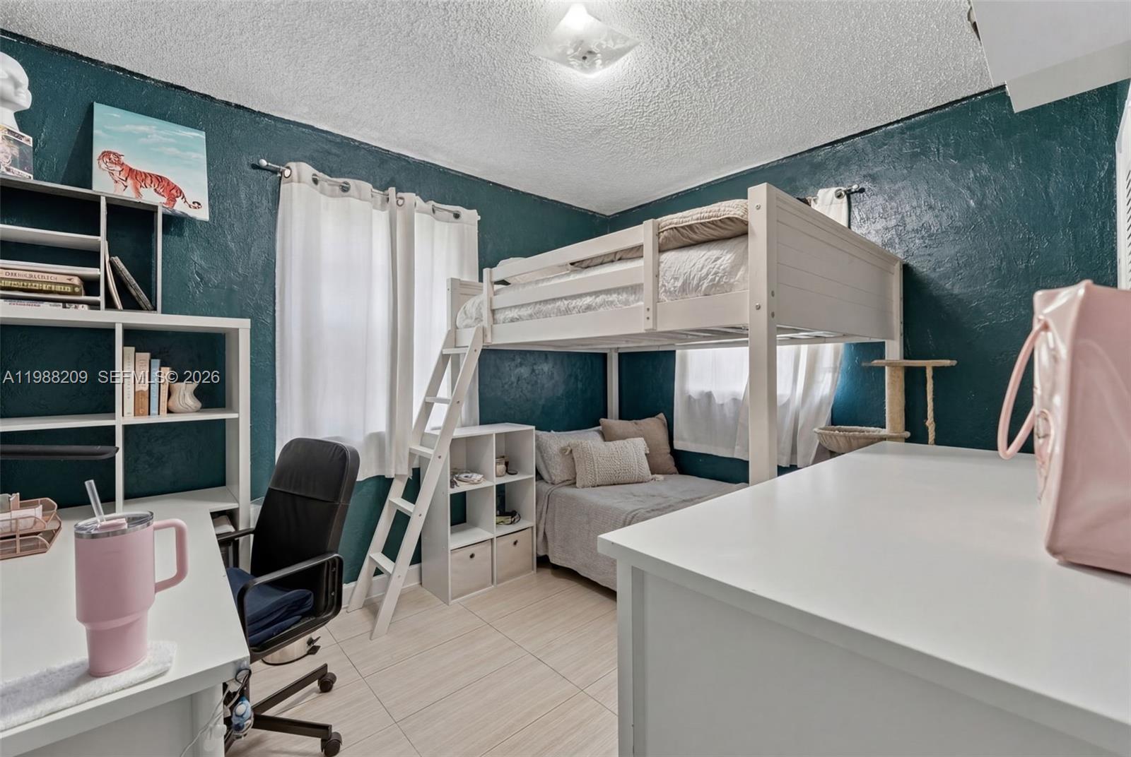 26672 Southwest 137th Court Homestead, FL 33032 - Photo 19 of 34 a living room with furniture and a fireplace