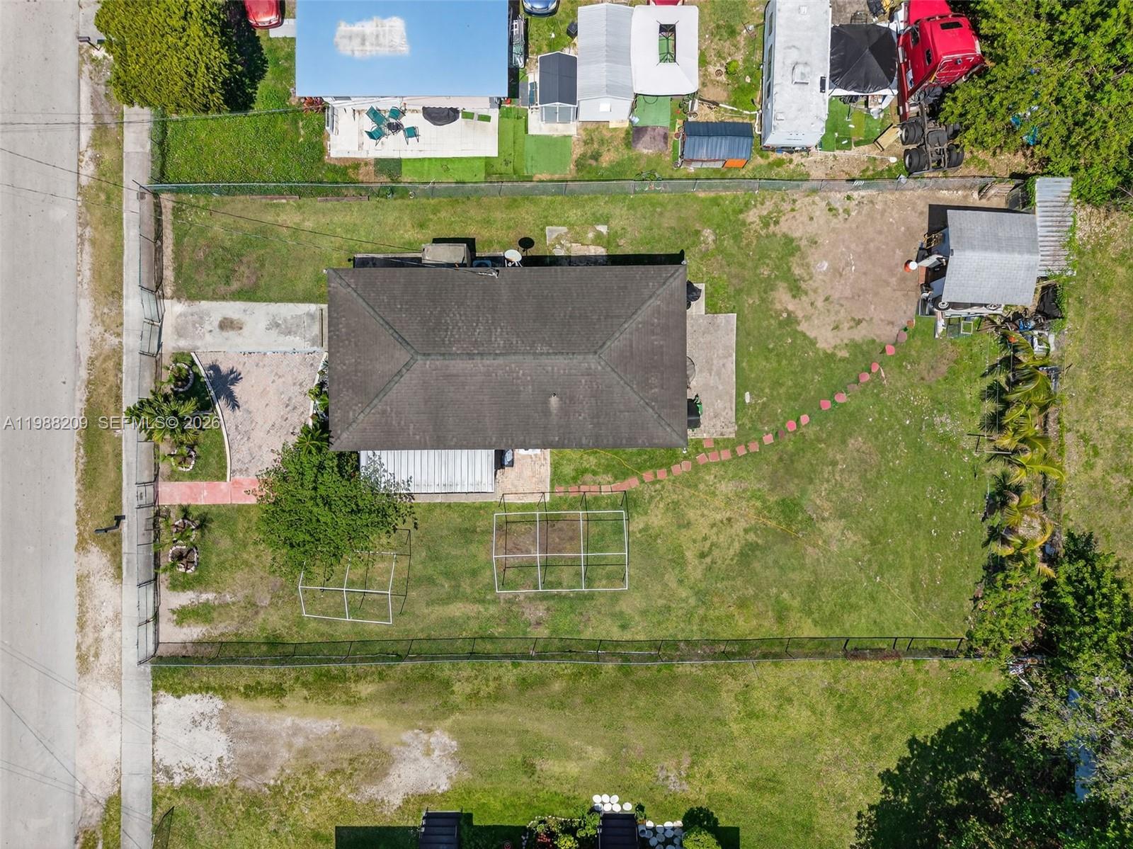 26672 Southwest 137th Court Homestead, FL 33032 - Photo 28 of 34 an aerial view of residential houses with outdoor space and swimming pool