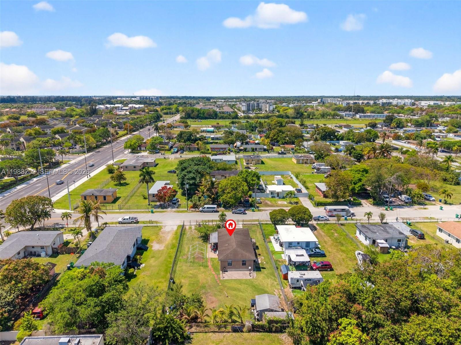 26672 Southwest 137th Court Homestead, FL 33032 - Photo 31 of 34 an aerial view of residential houses with outdoor space and swimming pool