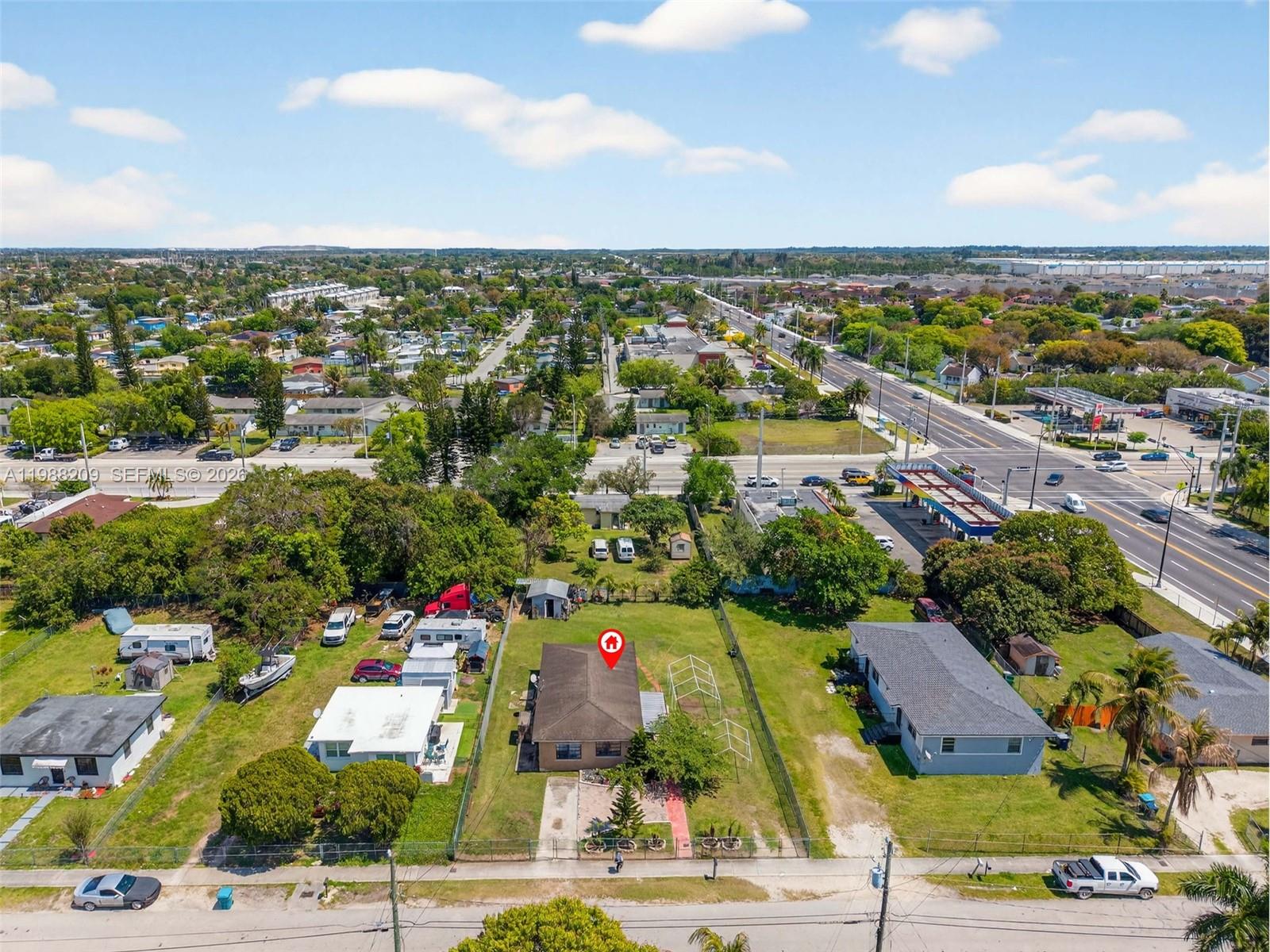 26672 Southwest 137th Court Homestead, FL 33032 - Photo 33 of 34 an aerial view of residential houses with outdoor space