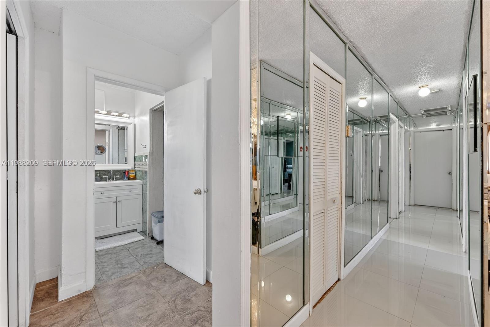 26672 Southwest 137th Court Homestead, FL 33032 - Photo 10 of 34 a bathroom with a glass shower door and a sink