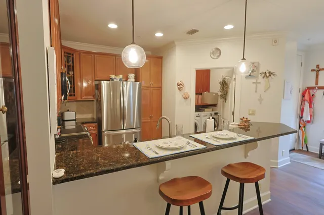 a kitchen with a table and chairs in it