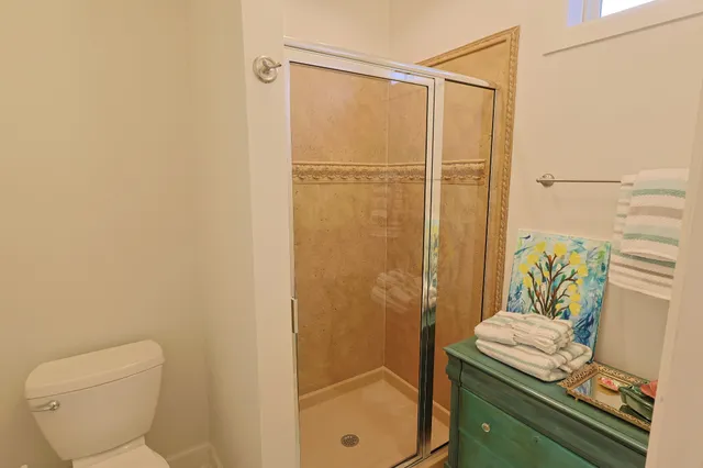 a view of a hallway with a painting on the wall