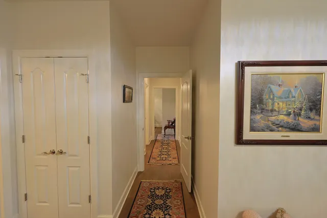 a view of a bathroom from the hallway