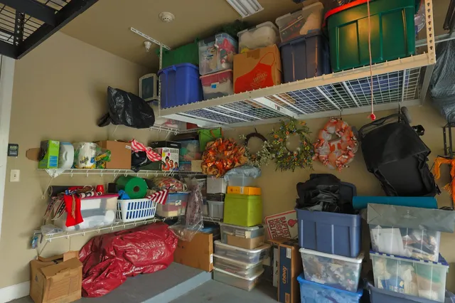an aerial view of multiple houses with a yard