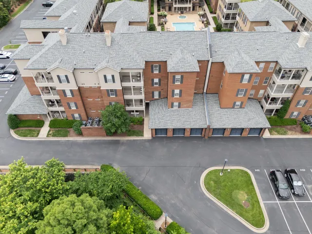 an aerial view of residential house with outdoor space and parking