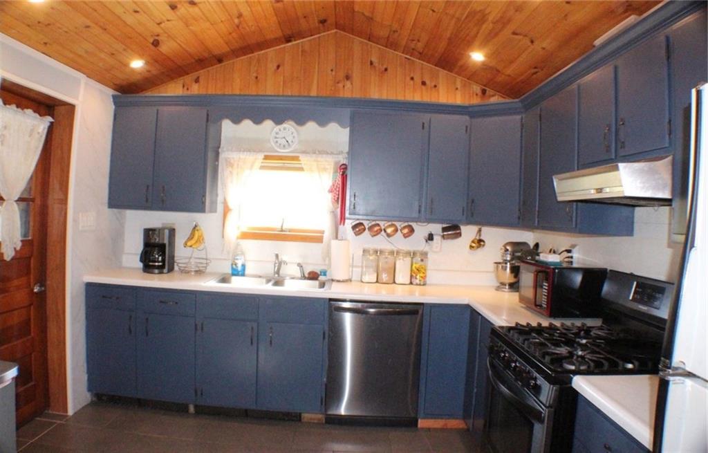 4218 Warren Road Indiana, PA 15701 - Photo 5 of 23 a kitchen with a sink a stove and cabinets