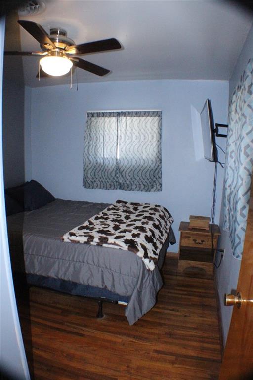 4218 Warren Road Indiana, PA 15701 - Photo 10 of 23 a bedroom with a bed and a chandelier