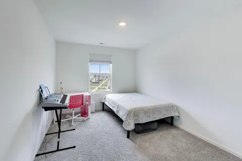 a view of a livingroom with furniture and cabinets