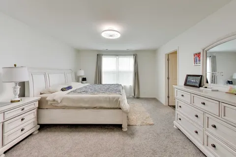 a bathroom with a sink vanity and a mirror