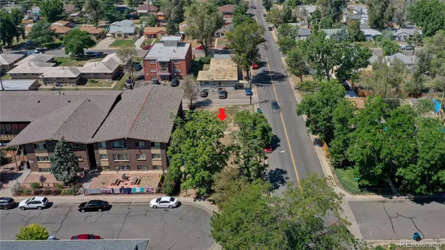 an aerial view of a houses with yard