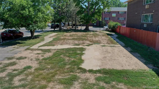 a view of a backyard with sitting area