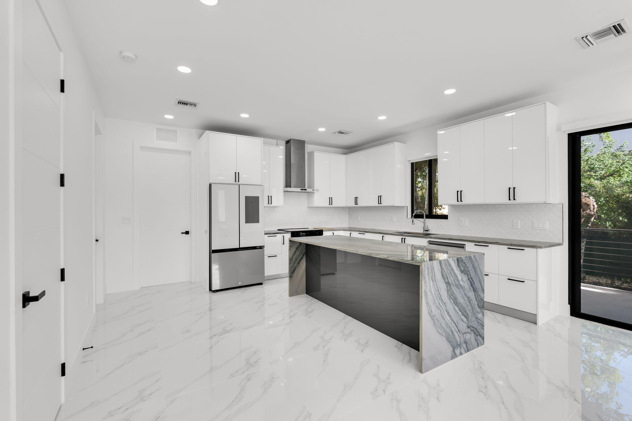 50 Transylvania Avenue Key Largo, FL 33037 - Photo 2 of 59 a large kitchen with kitchen island a sink stainless steel appliances and cabinets