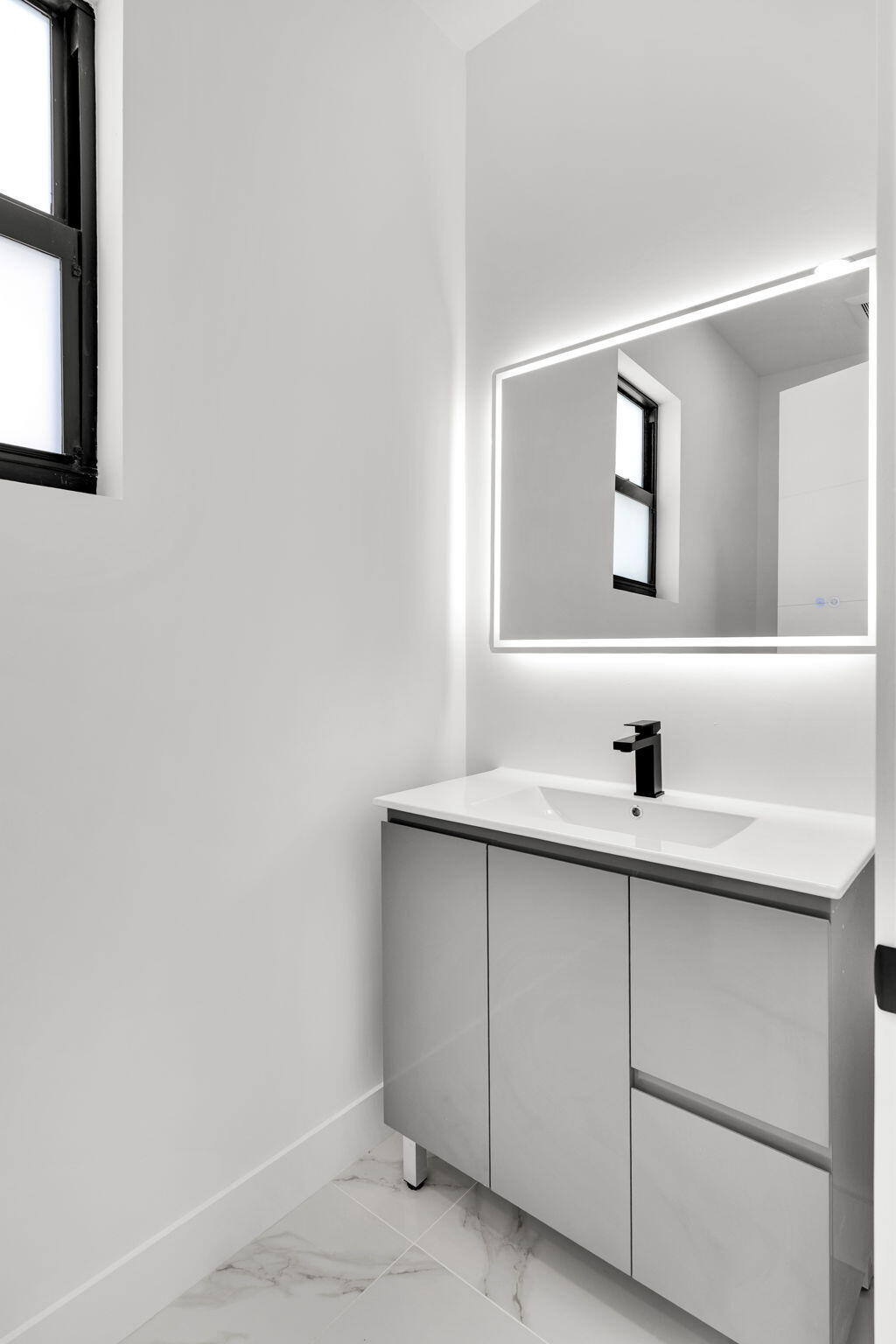 50 Transylvania Avenue Key Largo, FL 33037 - Photo 22 of 59 a bathroom with a sink and a window